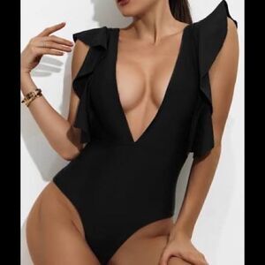 SHEIN one-piece swimsuit features ruffle details at the shoulders. Large